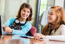 Two middle school students working together