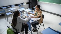 Teacher meeting with student