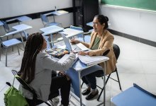Teacher meeting with student