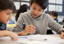 Two students working together to solve problems in math class