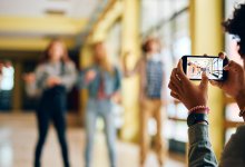 Students filming each other with a smartphone