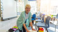 Teacher setting up classroom