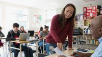 Photo of high school student and teacher in classroom