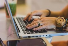 Woman typing on laptop